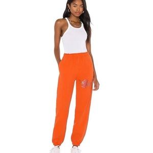 Orange boys lie sweatpants